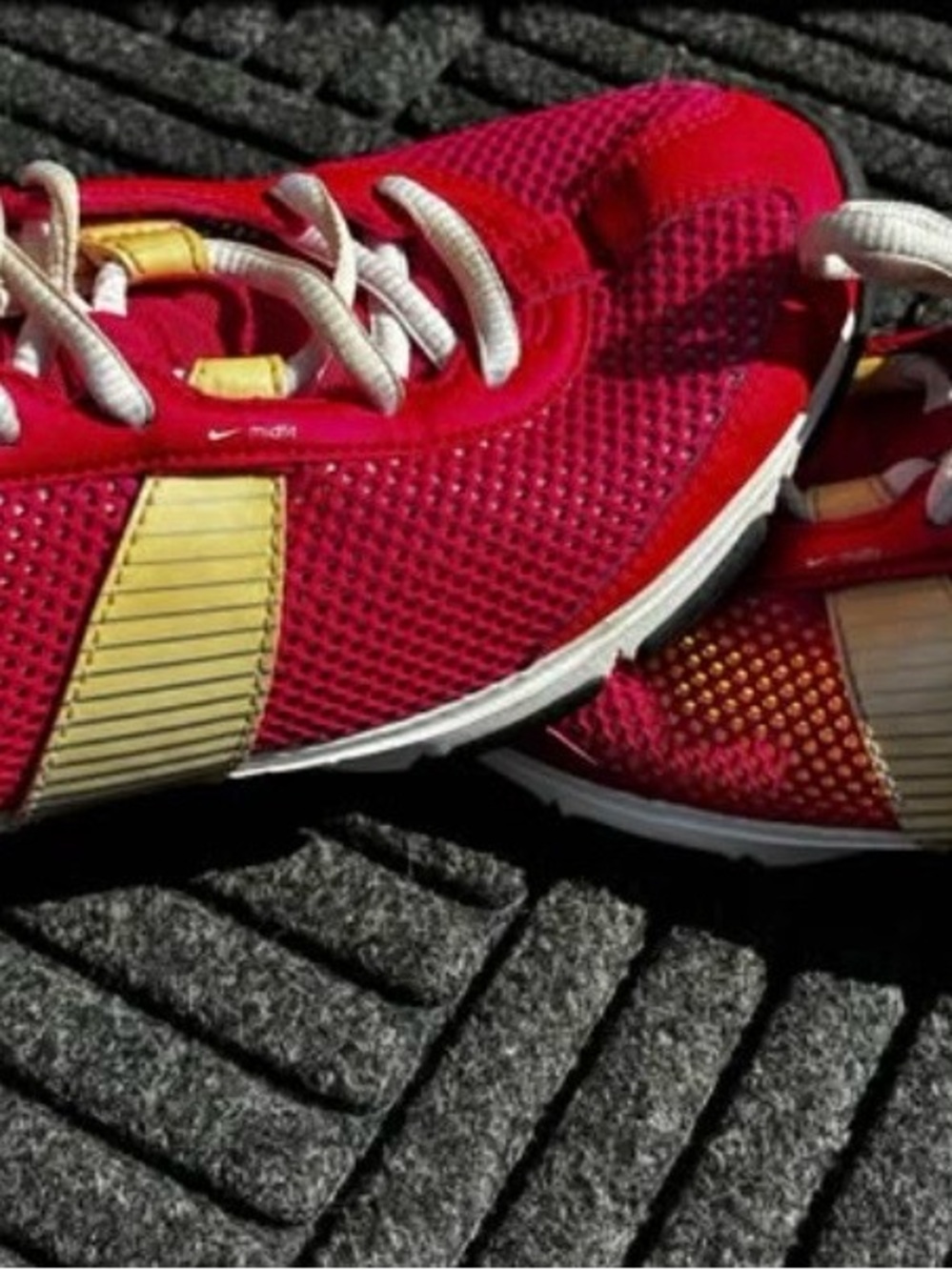 Nike Women's Red Athletic Sneakers with Gold Detailing